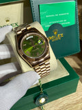 Rose gold-tone day/date automatic watch, green Roman dial
